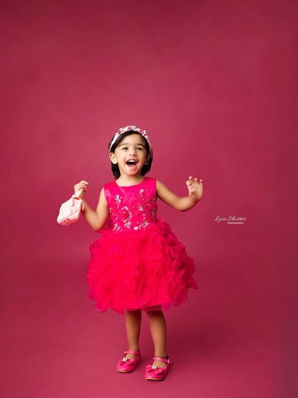 A moment of pure excitement! We love capturing the expressive and joyful personalities of toddlers during our studio sessions.