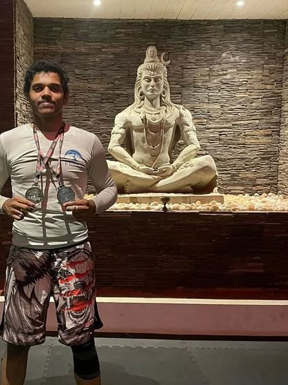 A moment of calm with my medals after the tournament in Goa. The discipline of Jiu-Jitsu brings balance, symbolized here by the statue of Shiva.