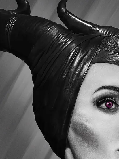 A close-up on Maleficent's face, highlighting her striking purple eyes and the sharp, defined cheekbones. The challenge was to create a look that was both beautiful and intimidating.