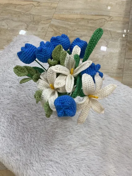 I call this my ocean blue bouquet. It features a stunning combination of deep blue tulips and delicate white lilies, creating a fresh and calming feel. I absolutely loved how this one turned out.