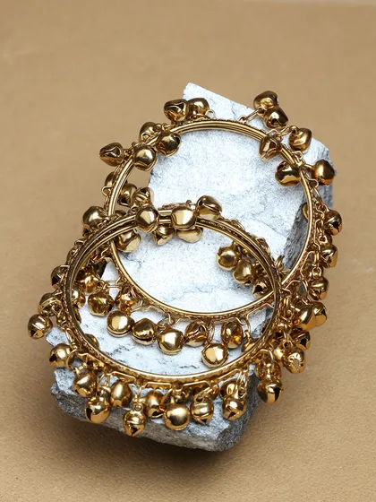 A pair of gold-plated bangles with dangling ghungroos for a beautiful jingling sound.