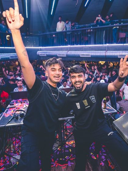 Sharing the console with another DJ. The camaraderie and shared passion for music are some of the best parts of this industry.