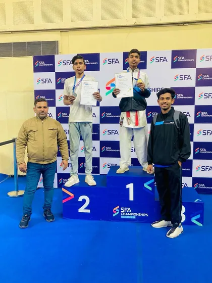 Standing with my champion Dhanraj on the podium. His victory is a victory for the entire academy.