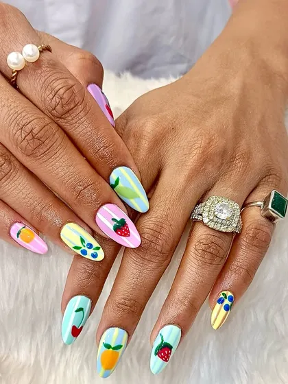 Your nails should be as fun as you are. This playful set features hand-painted strawberries, blueberries, and citrus fruits on a colorful pastel background, proving that nail art can be a total mood-booster.