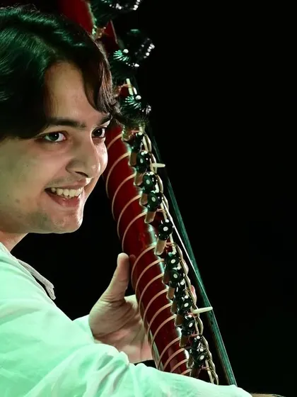 A close-up shot capturing a moment of joy during the performance. Celebrating the life and work of a legend like Kumar Gandharva Ji through music is a true blessing.