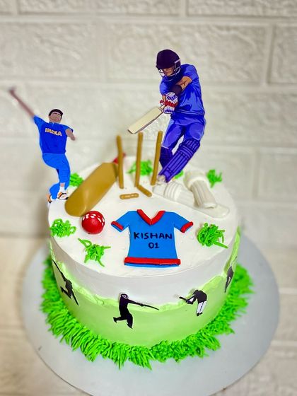 A closer look at the details on our crunchy butterscotch cricket cake, including the bat, ball, and jersey.