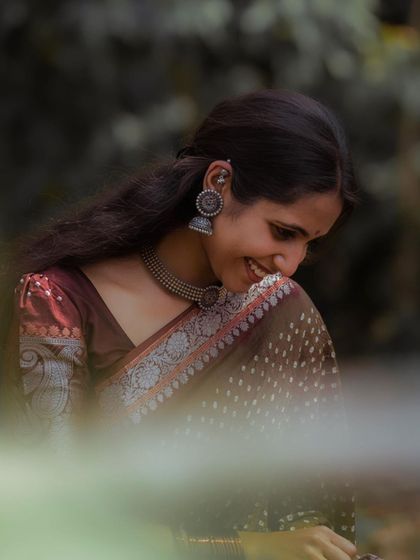 A shy smile captured during a photoshoot.