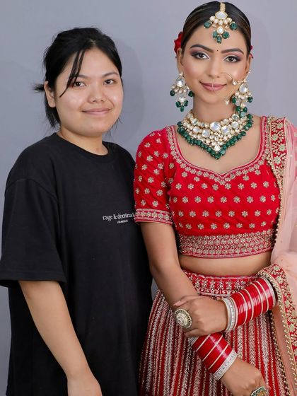 This student and her model are all smiles after a successful portfolio shoot. I ensure my students not only learn but also enjoy the process.
