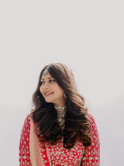 A close up of the bride's beautiful curls. The hairstyle is simple yet elegant, allowing her natural beauty to shine.