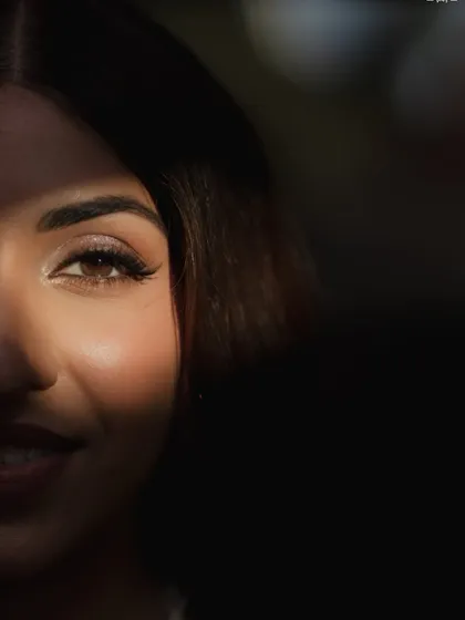 A moment of quiet before the Sangeet storm. This artistic shot of Sheena highlights the soft-glam eye makeup we designed. The subtle wing and warm shimmer were created to sparkle under the party lights while still feeling elegant and refined.