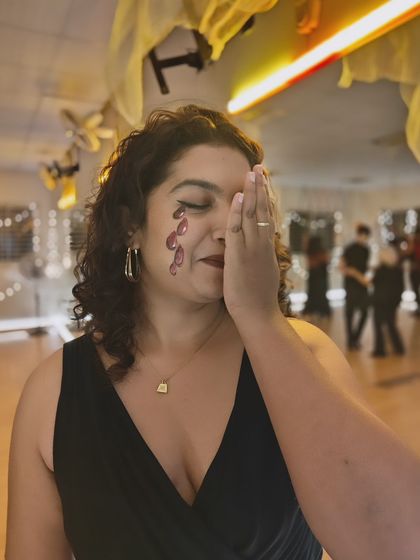 A glimpse into the spooky fun at our Halloween studio social. Here, one of our students shows off her creative face paint, getting into the spirit of the night.