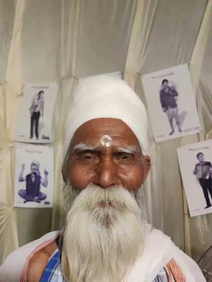 A visitor at my exhibition stall in Ayodhya, posing in front of the artwork.