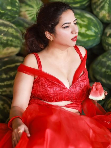 A creative and vibrant summer-themed shoot with an actress in a red outfit surrounded by watermelons. This series is playful and colorful, perfect for a brand campaign or a unique portfolio piece.