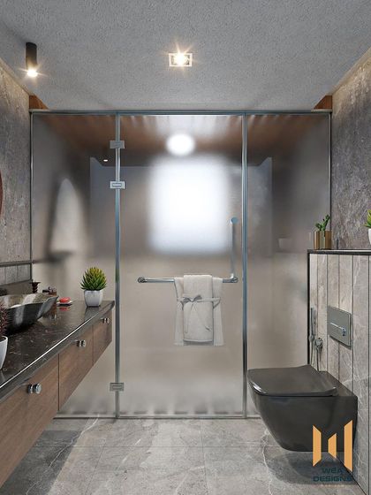 A bathroom with a grey monochrome design, featuring a floating wooden vanity and a frosted glass shower partition.