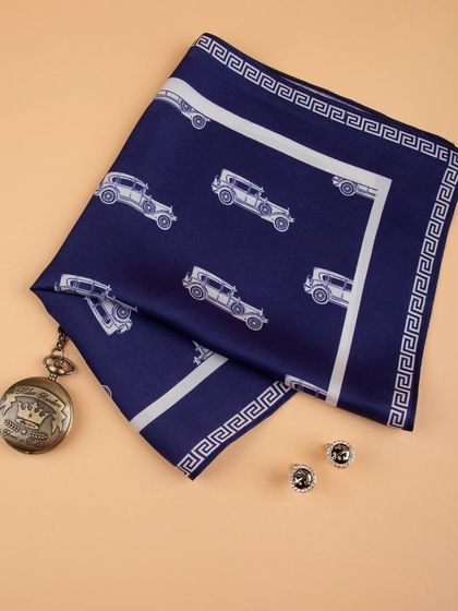 The vintage car pocket square styled with cufflinks and a pocket watch, creating a classic, masculine theme.