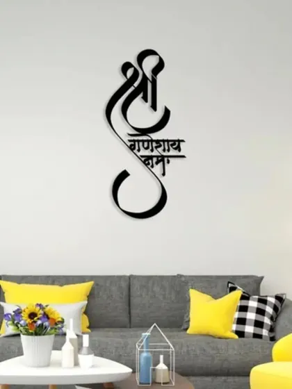 Make a statement with this "Shree Ganeshay Namah" metal wall art. The beautiful calligraphy and black finish create a piece that is both spiritual and modern, perfect for bringing blessings and grace to your home.