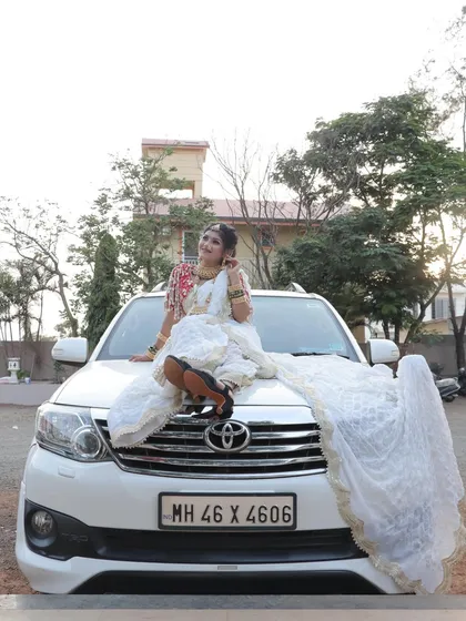 A fun and modern bridal shot, showing that today's bride is confident and full of personality. The beautiful makeup and traditional attire look stunning in any setting.