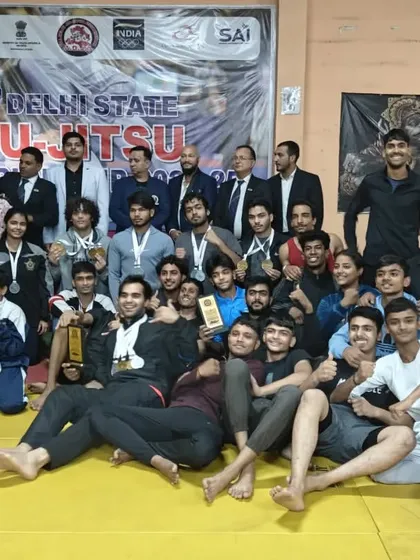 A large group photo of all the winners and participants at the Delhi State Ju-Jitsu Championship, showing the thriving grappling community we are part of.