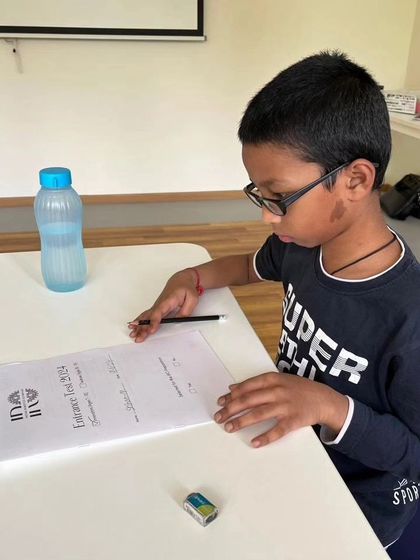 A student concentrates on his IRO entrance test. This assessment helps us identify children with the aptitude and interest for our competitive robotics program.