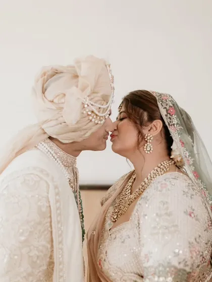 A sweet kiss to seal their vows. This classic shot is a must-have, captured with soft, beautiful light to enhance the romance.