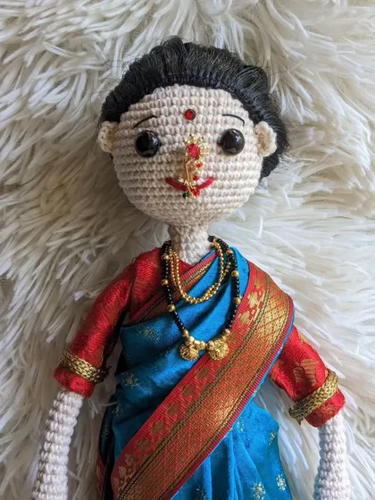 Another portrait of the traditional doll, showing the detail in her face and jewelry.
