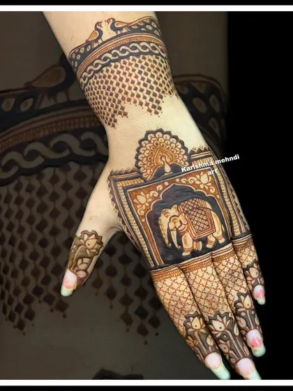 This single-hand design showcases a majestic elephant, a classic symbol in Indian mehendi. The clean lines and bold shading make it a standout piece for any event.
