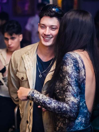 A candid moment of interaction between guests. My parties are great for socializing and making new connections.