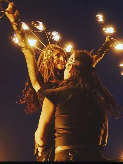 An artistic and intimate moment from a duo fire performance. This image captures the connection and trust between our artists as they perform together.