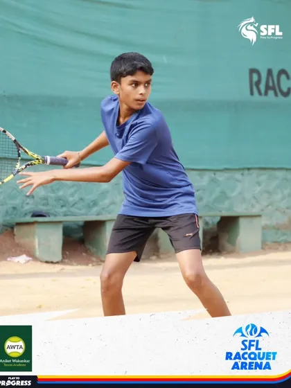 In action on the clay court, this young player demonstrates a solid backhand technique. We provide training on different surfaces to create well-rounded athletes.
