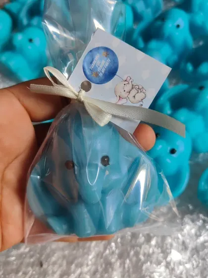 An individually wrapped elephant soap, showing how I package my return favors with a custom tag.