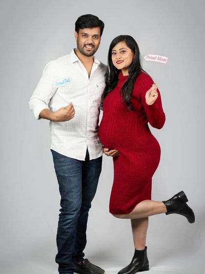 Proud Dad & Proud Mom! I love capturing the fun and playful side of my clients with cute props like these little signs.