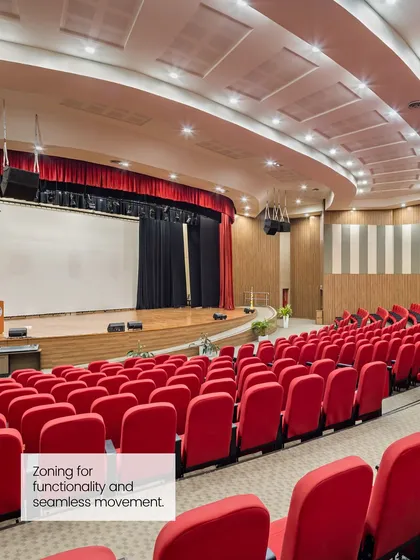 A well-designed medical campus includes spaces for learning and collaboration, like this auditorium. Our master plans enable seamless movement between hospital units, classrooms, and research areas.