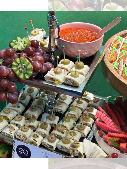 More fun from our kids' party grazing table. We offer a variety of easy to hold snacks like these tortilla pinwheels, served alongside fresh grapes and salsa, making it simple for little hands to enjoy.