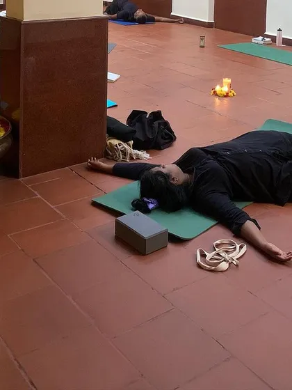 Another angle from a beautiful workshop, showing everyone in their own state of deep rest. The goal is to feel, not to perform.