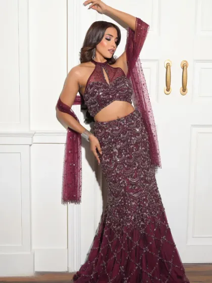 A dynamic and confident pose. The makeup is bold and beautiful, matching her energy and the glamour of the event.