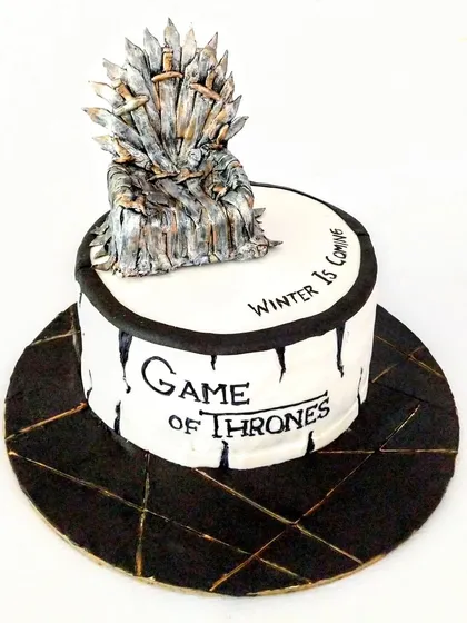 For the ultimate Game of Thrones fan, I handcrafted this Iron Throne cake. Each and every sword on the throne was individually made from fondant, a process that took hours but was worth it for the final look. The cake itself was a rich Ferrero Rocher flavor.