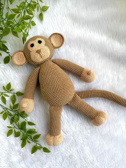 A playful monkey with a long tail, perfect for swinging around. This is my own custom design, and he's ready for lots of jungle adventures.