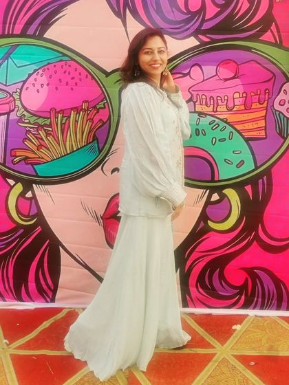 Posing against a funky, colorful backdrop. I love when venues have these fun photo opportunities.