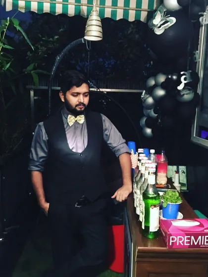 Dressed for the occasion in a bow tie, our bartender is ready for a card party or a formal celebration.
