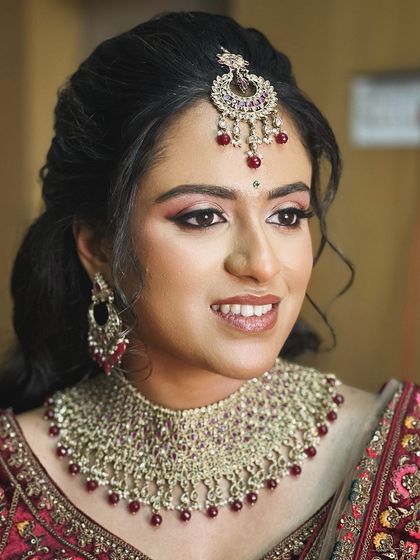 A close-up of her makeup, with a focus on the rosy eyeshadow and defined lip.