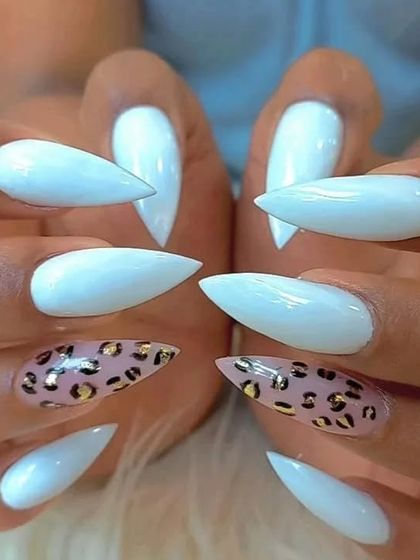 A head-on view of the fierce white and leopard print stiletto nail set.
