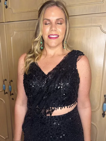 A close-up of Erica's makeup. I created a soft, shimmery eye look and a bright pink lip that popped against the black outfit.