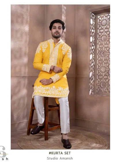 Perfect for a vibrant Haldi ceremony or a daytime festive event, this zesty yellow kurta is a celebration of color and craft. We've adorned it with delicate white crewelwork embroidery on the shoulders, cuffs, and hem for a fresh and joyful look.