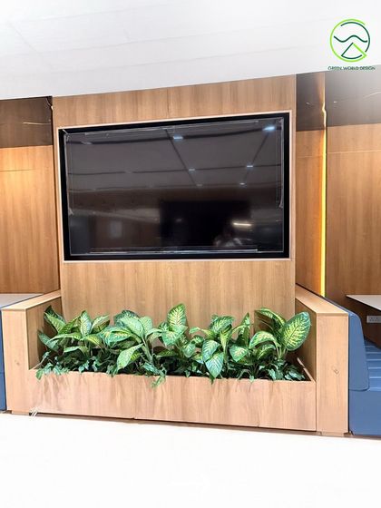 Here, planters are integrated into a media wall unit. This design solution ensures that even functional areas are infused with nature, reinforcing the principle that biophilic design should be part of the core infrastructure, not just an addition.