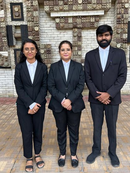 Teamwork makes the dream work. Standing with my associates, ready to take on any legal challenge.