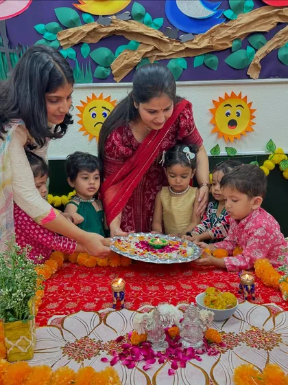 A group of children learning to hold the puja thali together. Our Diwali celebration is filled with moments of learning, sharing, and togetherness.