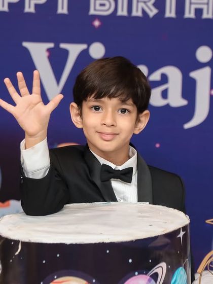 A charming 'Baby Boss' themed birthday party, with a sophisticated black and white color scheme, custom props, and a stylish backdrop, perfect for a little executive.