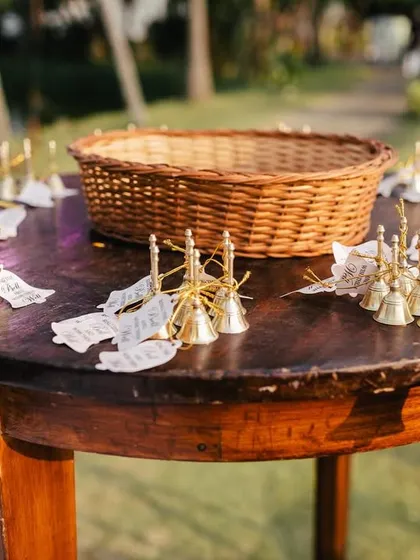 The guest favor table, beautifully arranged with bells and petal cones. I believe in presenting every element of the wedding in an aesthetically pleasing way.