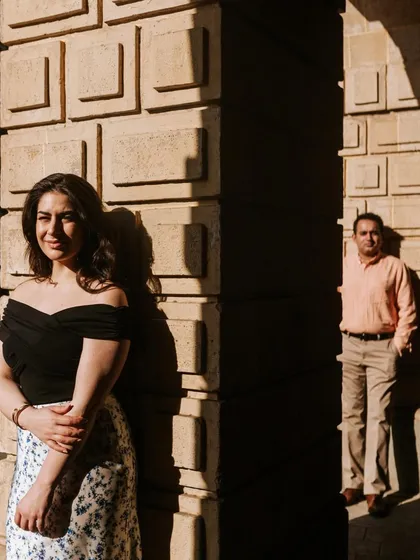 Using dramatic light and shadow to create an artistic couple portrait. The contrast adds depth and a cinematic feel to this engagement photo.