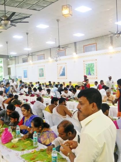 A wide shot of the dining hall, showing my team serving a full house. Managing such large-scale traditional meals is a skill I have perfected over 25 years.